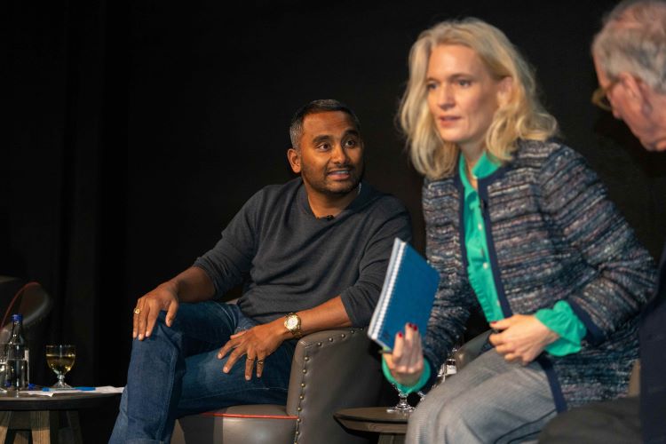 Speakers interacting at StratFest2025.